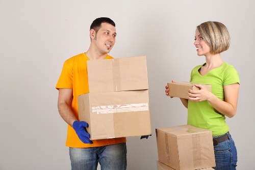 Family moving items into short-term storage during a house move